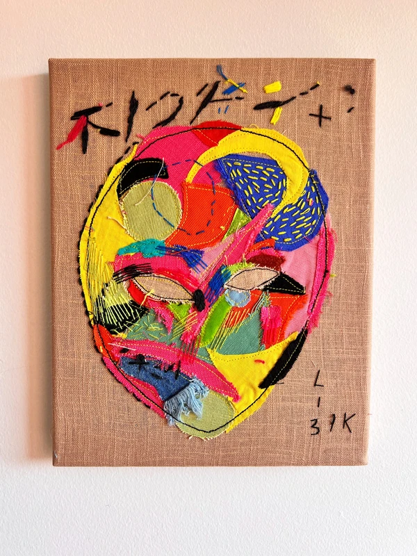 A mask of mixed feelings.