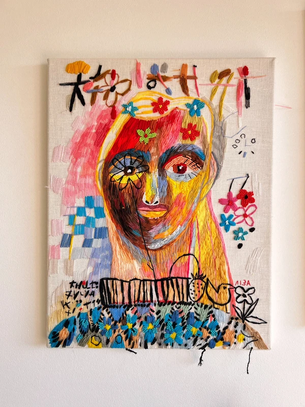 Girl in a sweater with flowers